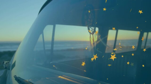 Driver sitting van, low sun shifting, golden stars drifting across windshield over glass for travel