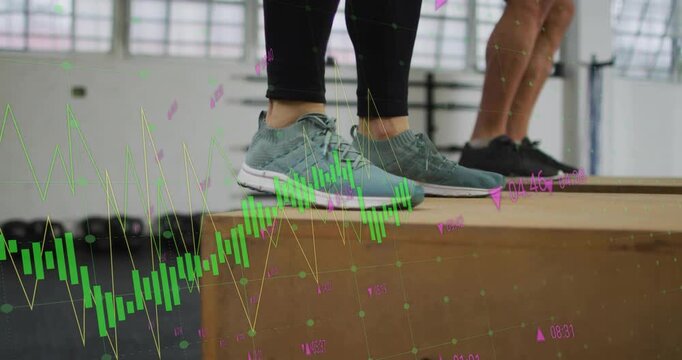 Female and male partners stepping forward performing timed box jumps in gym charts overlaying feet