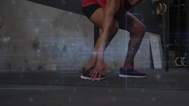 Woman running toward camera, performing agility drill in gym, HUD overlay tracking single-leg hops