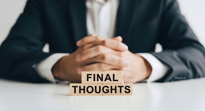 A man in a suit with final thoughts on a block of wood