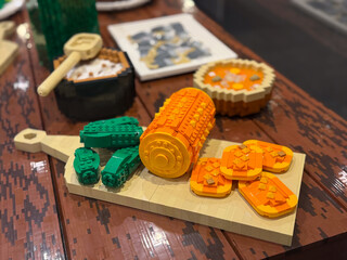 Fototapeta premium Toy brick sushi set on cutting board close-up