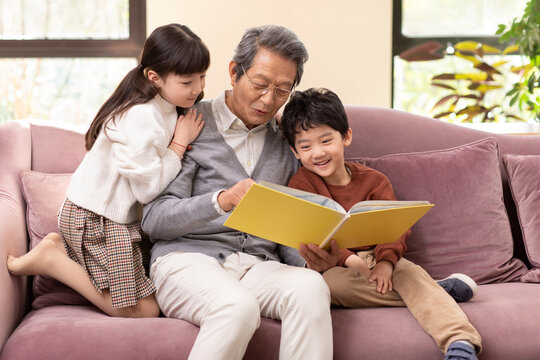 Story time with Grandpa on the couch