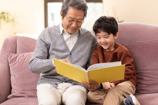 Story time with Grandpa on the couch