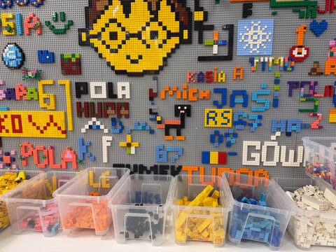 Organized lego mosaic wall with sorted bins