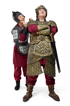 Humorous studio shot: armored ancient general and soldier