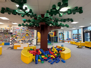 Naklejka premium Indoor play area with giant blocks and tree