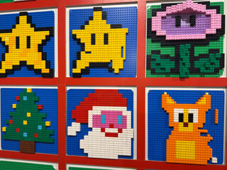 Naklejka premium Colorful lego pixel-art mosaics in framed grid