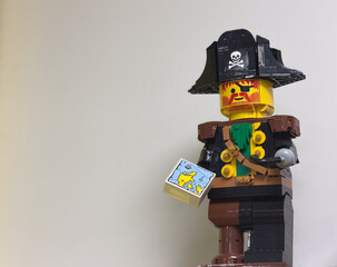 Naklejka premium Lego pirate minifigure with treasure map