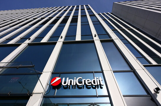 Ł&oacute;dź, Lodz, Poland, Europe - 02.2026 : Logo of UniCredit Bank - Italian multinational banking group, Hampton by Hilton Hotel in Hi Piotrkowska skyscraper, seen from Mickiewicz Avenue