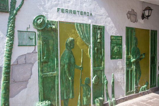 Puero de Mog&aacute;n, Spain  17 May 2025,  Artistic facade design with relief figures in Puerto de Mog&aacute;n, Gran Canaria