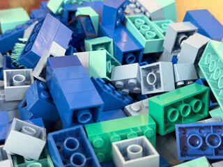 Naklejka premium Blue and teal building block pile
