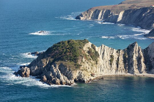 Aerial view of jagged cliffs meet the turquoise sea, a rugged coastline sculpted by time and tide, Istanbul, Istanbul, Turkey.