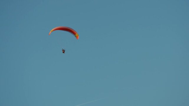 paragliding in the blue sky