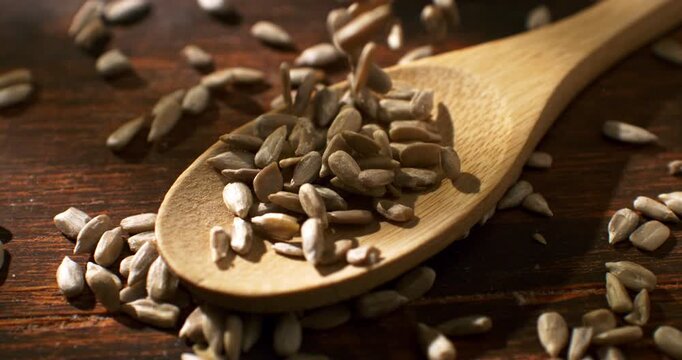 Slow Motion Macro Of Sunflower Seeds In Spoon In Close Up Concept Of Healthy Snack And Nutrition