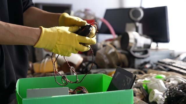 E-waste in the recycling center. Collection sorting disassembly and repair of broken household appliances and electronic waste