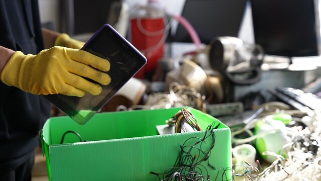 E-waste in the recycling center. Collection sorting disassembly and repair of broken household appliances and electronic waste