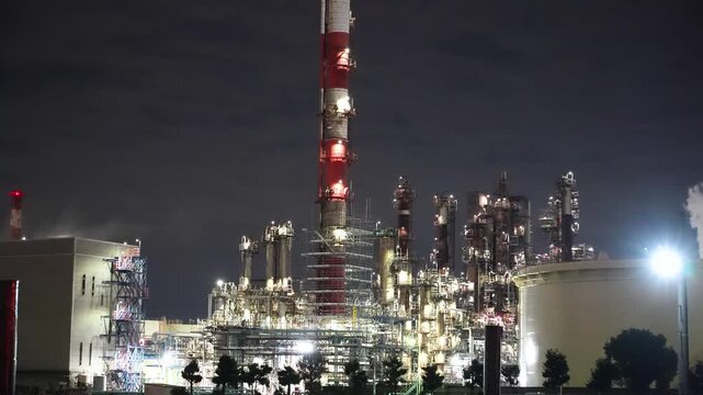 Night view of  industrial complex with glowing refineries