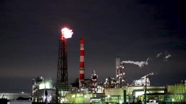 Night view of  industrial complex with glowing refineries