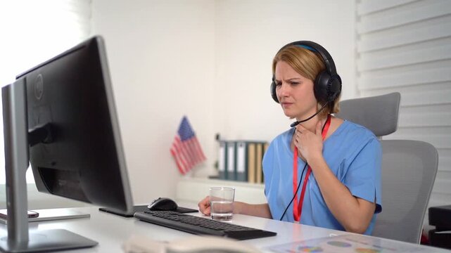American female doctor with a sore throat during an online consultation