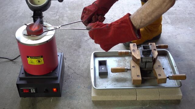 White-hot crucible is removed from furnace, molten metal poured into flask mold, and crucible replaced in furnace.