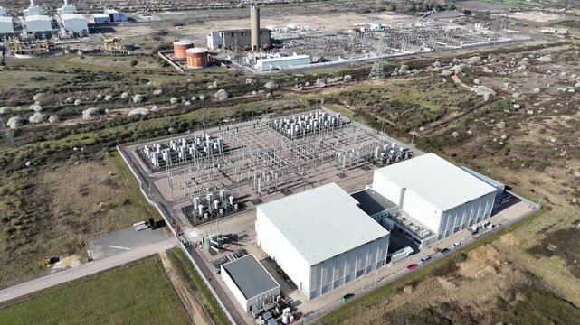 Electrical substation Grain CHP Power Station Kent UK Panning drone aerial