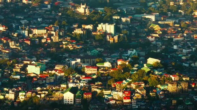 Drone sliding right over Baguio City at sunrise Benguet Philippines skyline