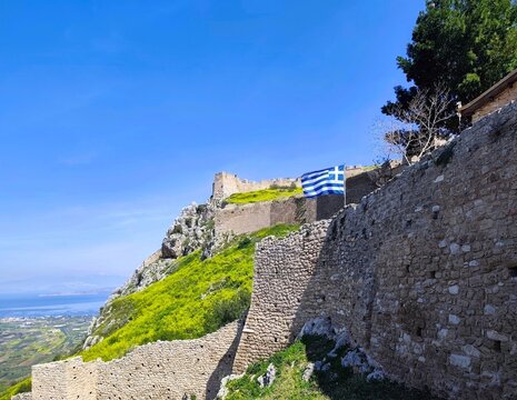 Photo of the walled gates of Acrocorinth, restored by the Venetians, it is a towering monolithic fortress that once guarded the ancient city of Corinth in Peloponnesus, Greece.