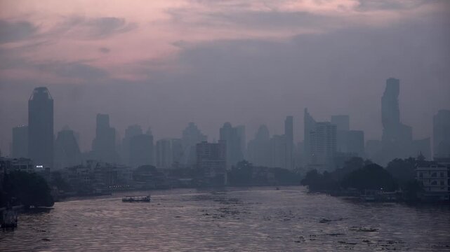 Cityscape of Bangkok covered by mixture of dust in air pollution. Heavy air pollution of fine particulate matter (PM2.5) in morning.