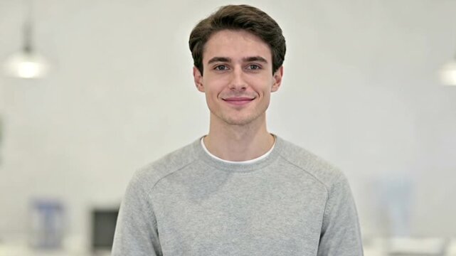 Young adult expressing confidence in studio portrait