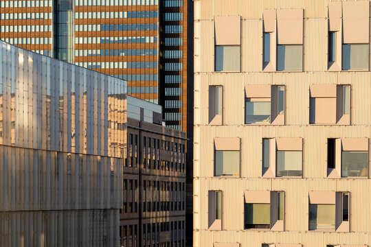 Modern urban buildings architecture with glass facade windows and geometry pattern detail forming an abstract modern background suited for design layouts