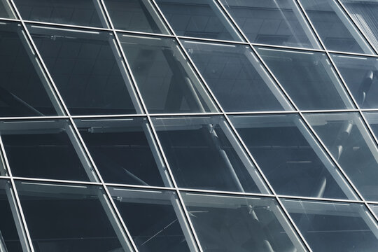 Modern glass facade architecture with windows grid geometry and abstract pattern on a sleek building creating a crisp modern background for design