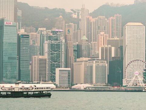 Tsim Sha Tsui Panorama: Modern Skyscrapers and Traditional Watercraft