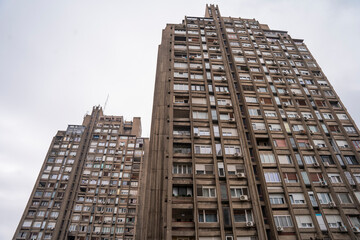 Fototapeta premium Wide angle architectural photograph of the iconic brutalist residential complex in Block 23. Panoramic view of the massive concrete structures and modernist housing project in Belgrade, Serbia 12.08.2