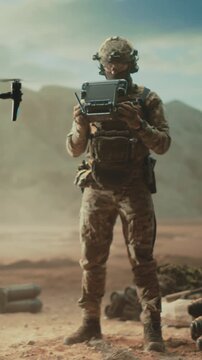 Vertical Screen: States Special Forces Soldier in a Middle East Desert Pilots a Tactical Drone Controller, Modern Strike Warfare, Reconnaissance, Target Acquisition, Combat Operation, Military Mission