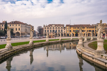 Fototapeta premium The grand elliptical Prato della Valle square with Isola Memmia, its canal and statues in Padova, Italy 02.01.2026