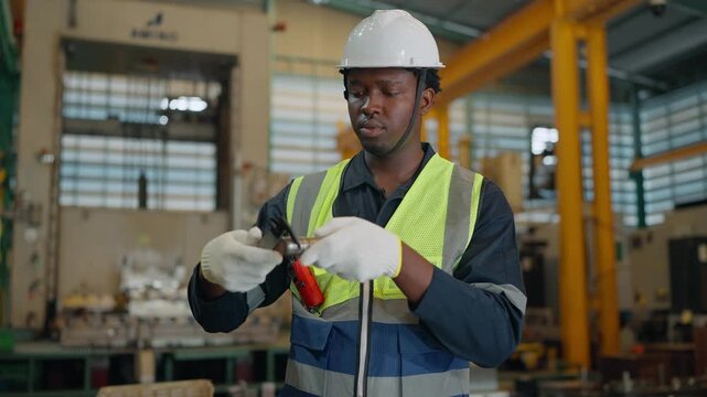 Precision in Progress: A focused engineer, equipped with a caliper, meticulously examines the dimensions of a component, representing expertise and dedication in industrial processes.