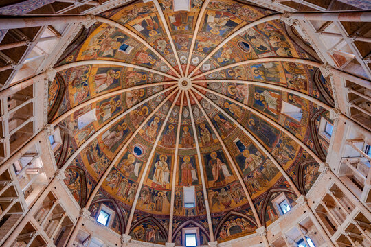 Interior view of the magnificent octagonal dome of the Parma Baptistery featuring medieval frescoes and religious iconography in Parma, Italy 06.01.2026