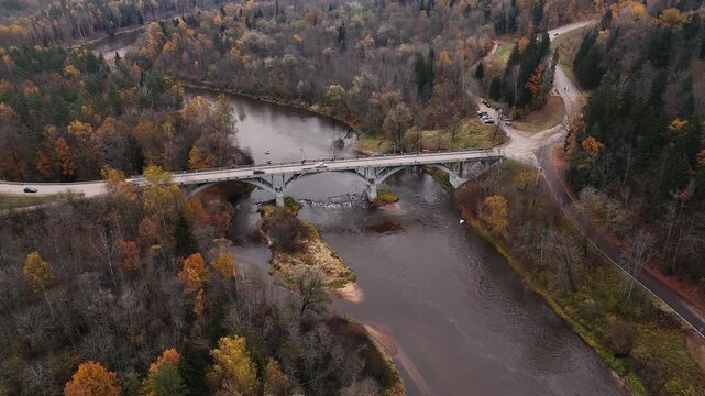 Aerial Autumn Flight Above Gauja National Park River and Sigulda Bridge