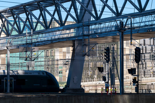 Oslo commuter train on steel railway bridge near station showing modern urban transport infrastructure and daily transit