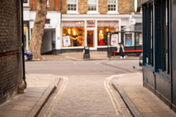 Blurred London High Street Shops – Narrow Alley Leading to Retail Shopping Scene Concept