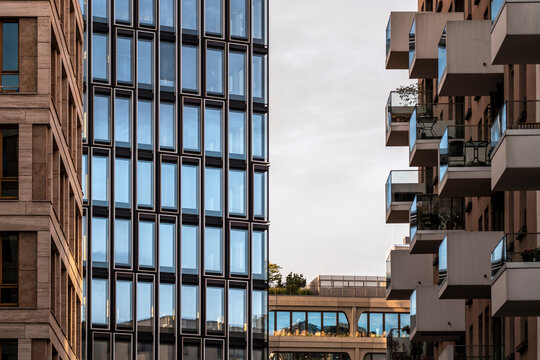 Urban city living in Berlin Germany shown by modern architecture building facade where repeating windows and balconies create rhythm and depth