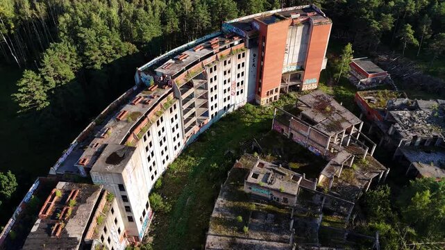 Abandoned Soviet Unfinished Hotel Near Baltic Sea Surrounded by Forest Aerial Drone View