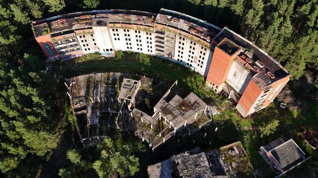Drone View of Abandoned Soviet Architecture Hidden in Forest Near Sea