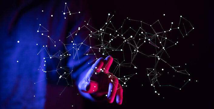Abstract futuristic image of a hand touching a network of connected nodes representing data communication and the futur