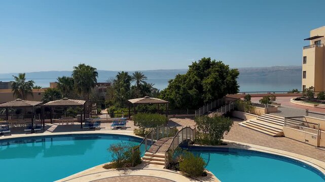 Swimming Pool At An Luxury Resort On The Jordan Side Of The Dead Sea Looking Towards Israel.