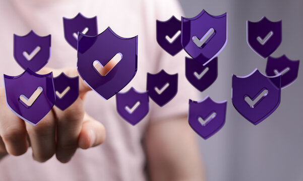 Concept of online security, digital data protection, and cybersecurity, with hand interacting with floating shields, eac