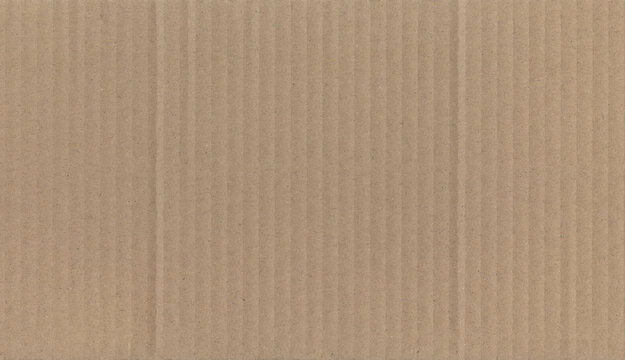 Corrugated kraft cardboard texture with subtle vertical lines and natural fiber surface. Ideal for packaging backgrounds, eco branding, mockups and industrial design.