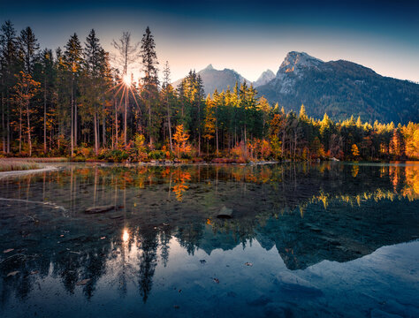 Calm autumn scene of Hintersee lake with Hochkalter peak on background, Germany, Europe. Stunning morning view of Bavarian Alps. Beauty of nature concept background.
