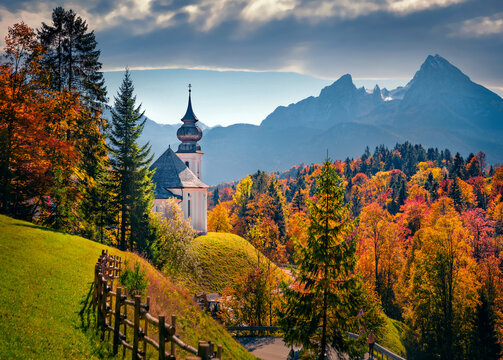 Iconic picture of Bavarian Alps with Maria Gern church with Hochkalter peak on background, Germany, Europe. Splendid autumn view of German countryside. Traveling concept background.