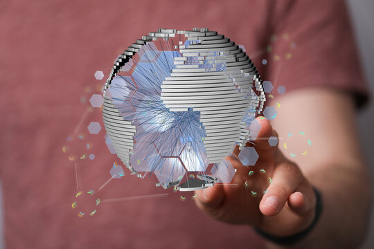 Digital globe representing a network, technology, connection and innovation concept, held by a hand. Visualization of gl